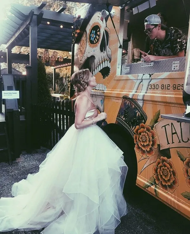 A bride at the lit-up Funky Truckeria truck during a private party